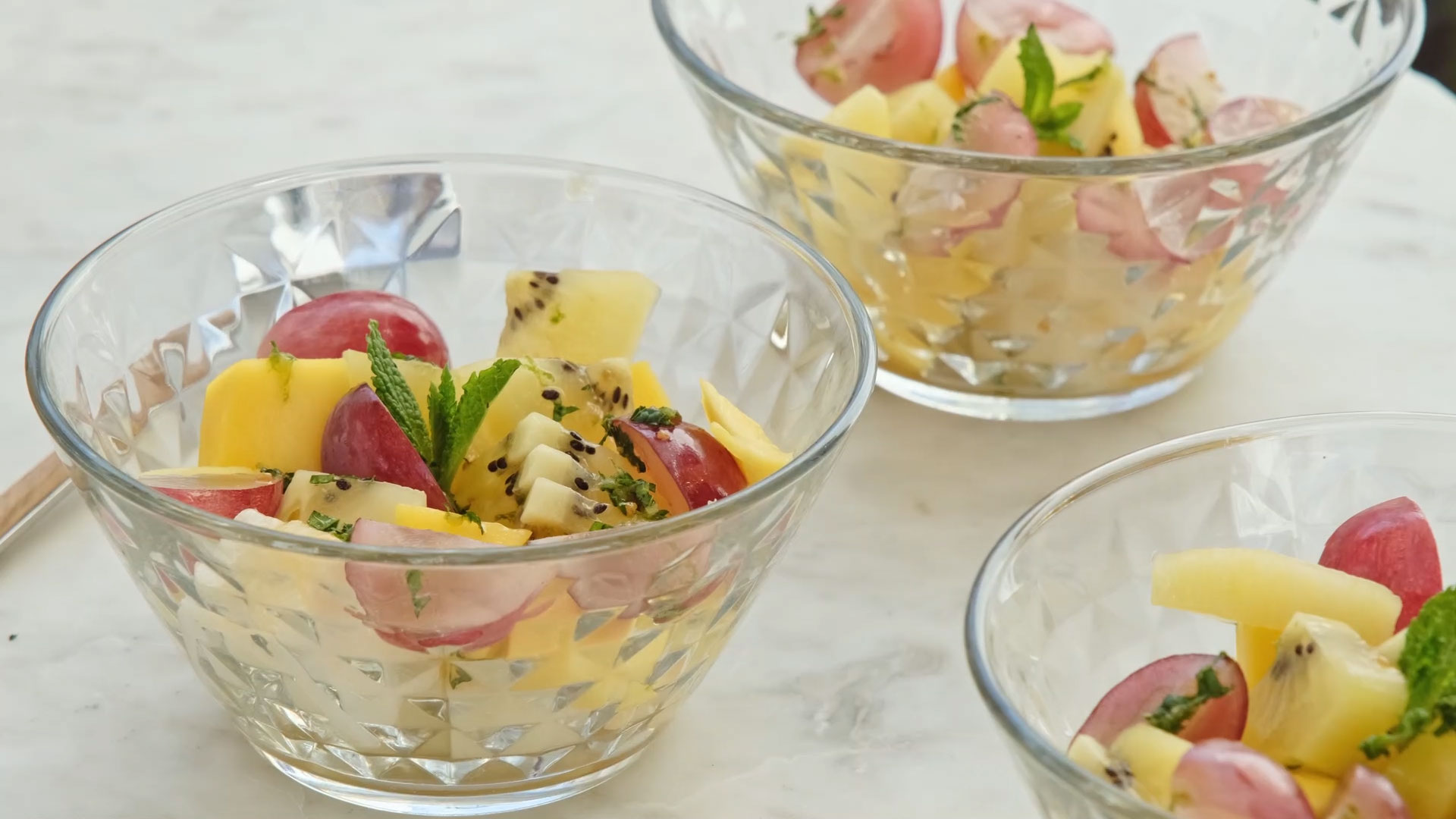 Fruit salad, fresh mint and lemon