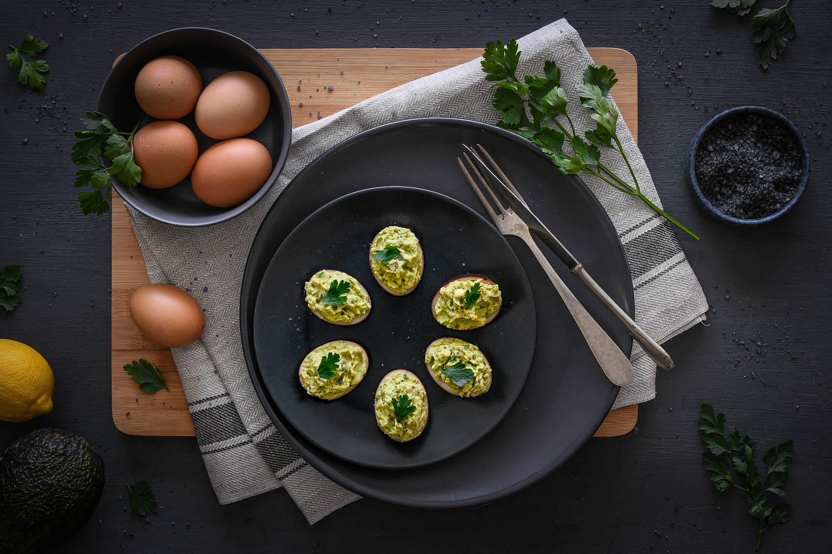 Avocado stuffed black eggs