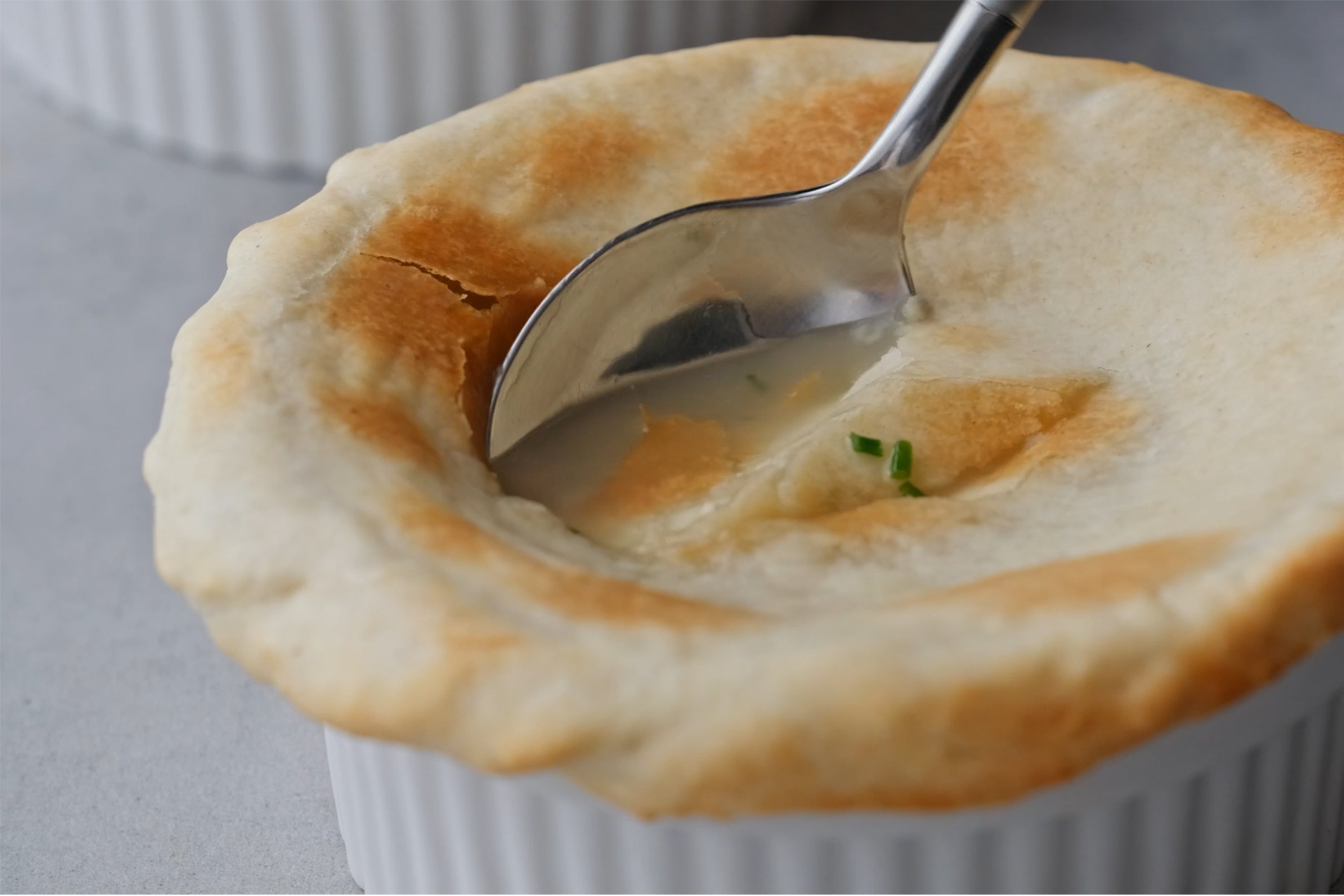 Chicken soup and crispy vegetables with puff pastry