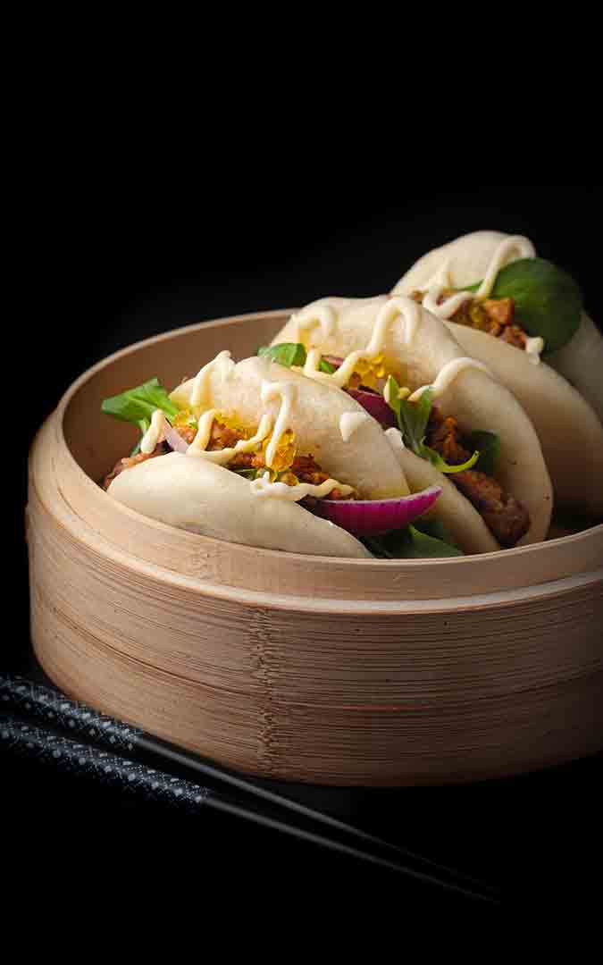 Bao buns stuffed with Peking duck