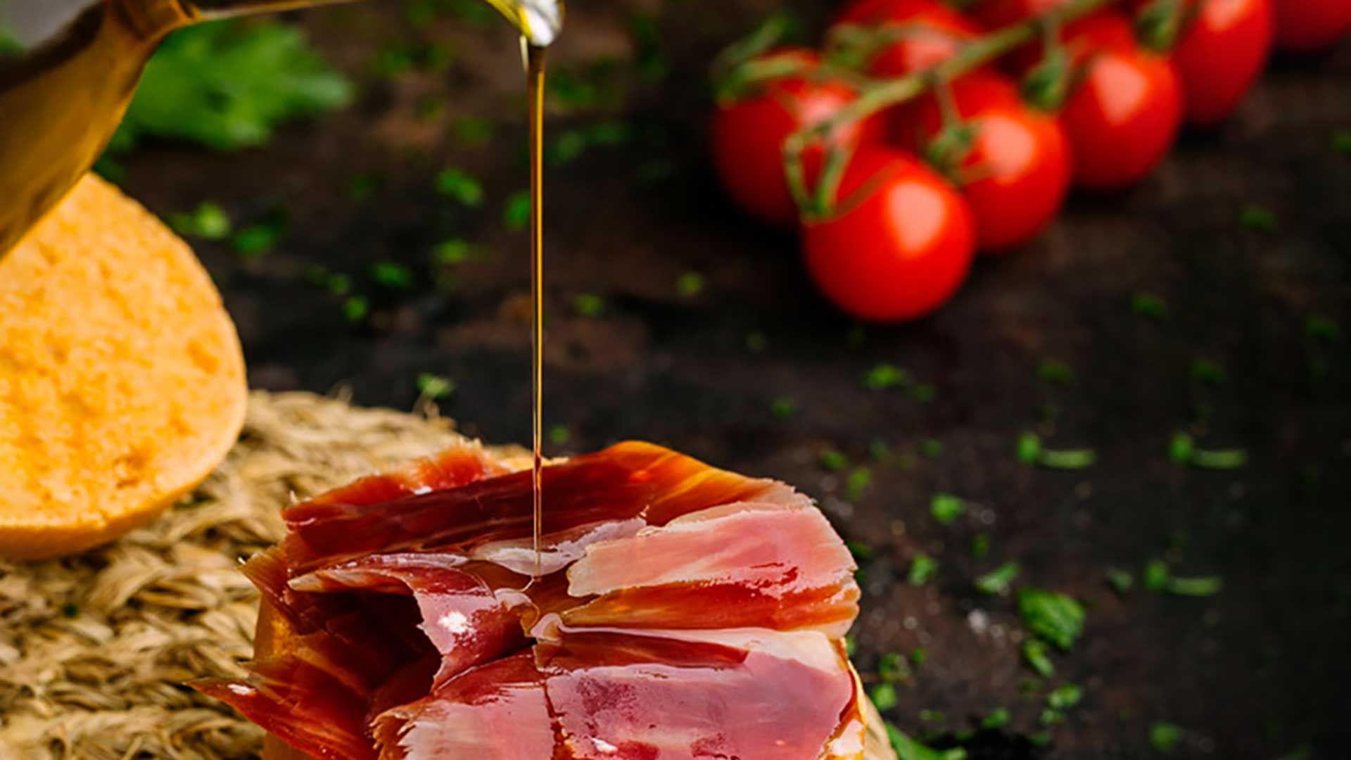Slice of homemade bread with tomato, ibérico ham, and olive oil from Aragón
