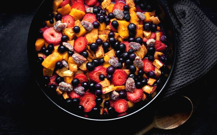 Baked fruit salad with caramelised pecans