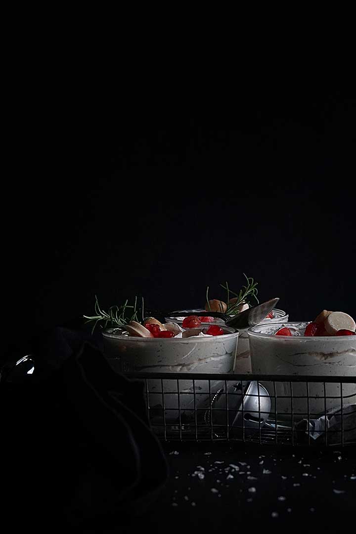 Macadamia and white chocolate mousse in bowls as a Christmas dessert